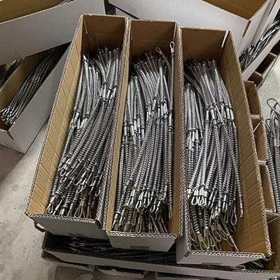 What is the use of the whipcheck safety cable ?
